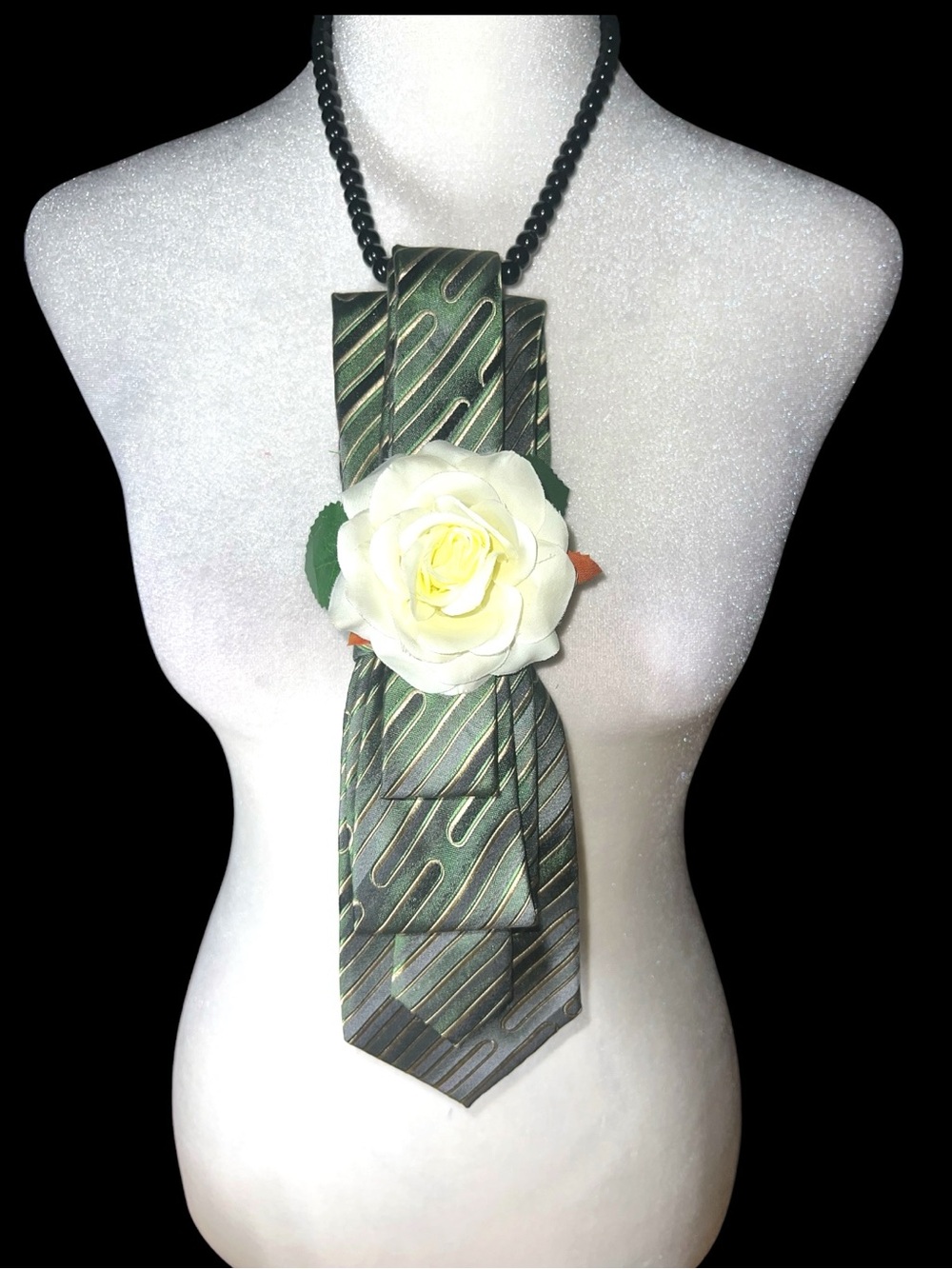 Handmade green necktie necklace with white fabric rose.